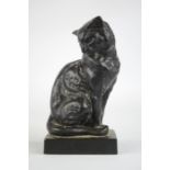 A Fremite model cat, painted black, labelled to the base, 14cm high.