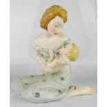 A ceramic mother and child, 20cm high.