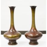 A pair of Chinese bronze vases, with residual deep red patination, 13cm high.