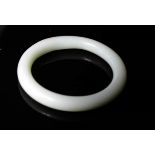 A Chinese pale green jade bangle.