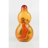 A Chinese glass reverse painted glass scent bottle of Maidens, signed by the artist, having inset