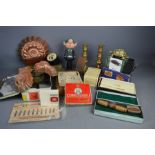 A box of assorted collectibles to include brass, candlesticks, tea cards, tins with contents, Jaguar