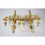 A pair of gilt metal wall lights.