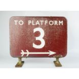 An original railway platform sign in red enamel, To Platform 3, 31cm by 35cm.