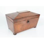 A 19th century mahogany tea caddy.