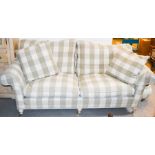 A two seater settee, check pattern.