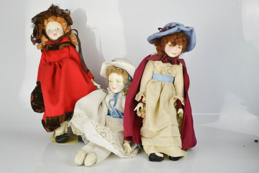 Three Royal Doulton dolls.