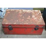 A large red tin trunk, 57cm by 36 by 91cm.