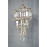 A 1930s crystal waterfall chandelier with ball point drops.