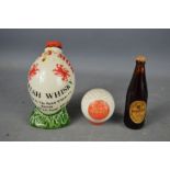 Brewerania: a novelty Scotch Whisky Golf ball, Welsh whisky rugby ball and a Guinness miniature.