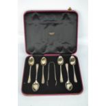 A set of silver spoons and sugar nips, in presentation box.