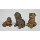 Three model dogs in bronze and brass.