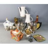 A mixed group of silver plate, tea pot, brass shell, Doulton figurine, bells whisky and other items.