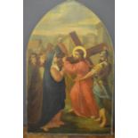 An early 19th century oil on canvas depicting a Station of the Cross, on an arch form frame, 87 by