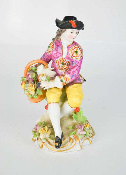 A German porcelain figure, 14cm high.