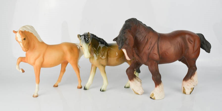 A Beswick Shire horse, Beswick pony and a similar example.