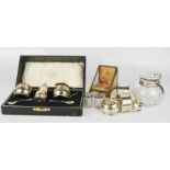 A silver cruet set, boxed together with a silver collar, glass dressing table bottle and a French