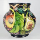 A Moorcroft vase, signed by William Moorcroft, impressed and signed 2000, 14cm high.