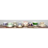 A group of porcelain coffee cans and saucers including Chelsea, Royal Doulton, Royal Worcester and
