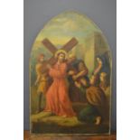 An early 19th century oil on canvas depicting a Station of the Cross, on an arch form frame, 87 by