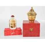 A Chinese scent bottle with the presentation box, together with a Chinese enamelled jar.