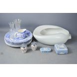 A box of blue and white pottery to include a Stewart vase, Wedgwood and a bed pan.