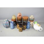 A group of Rye pottery, including biscuit barrel, tea and coffee jars, Royal Doulton vase etc.