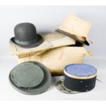 Two top hats, bowler hat; Celtic brand, and a French military hat.