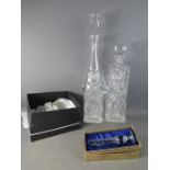 A group of glassware to include a pair of Waterford white wine glasses, a pair of decanters and