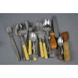 A group of flatware, pastry roller, can opener and pair of silver plated sugar nips.