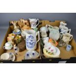 Two boxes of ceramics to include a Wade bambi deer, Royal Coronation mugs, tea pots, creamer, etc.