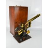 An antique microscope and original box, by Matthews, 8 Portugal Street, London, and lenses including