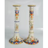 A pair of Rouen China candlesticks, 15 inches high.