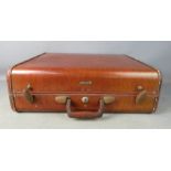 A leather vintage suitcase.