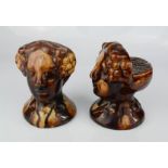 A pair of rare late 18th century stoneware treacle glazed furniture rests in the form of female
