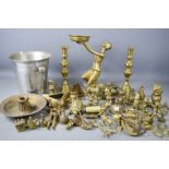 A collection of brassware to include candlestick, figure, ornaments, ice buckets and others.