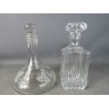 Two decanters; one pressed glass and one etched.