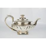 A George IV silver teapot, gadrooned rim, spiral fluted body and acanthus cast handle, 21.7toz.