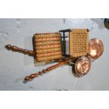 Two copper warming pans, and two small footstools.