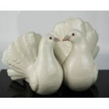 A Lladro group of two doves.