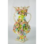 A 19th century vase, modelled with flowers.
