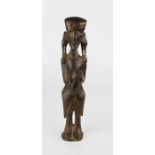 A wooden carved African female figure, 20cm high.