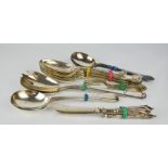 Three silver handled butter knives, and silver plated flatware.