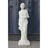 A garden statue of a lady in Roman attire.