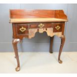 A red walnut lowboy 83 by 46 by 91cm,