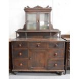 A Victorian pine sideboard, stained dark brown, 122 by 49 by 163cm.