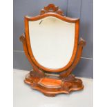 A Victorian shield form toilet mirror.