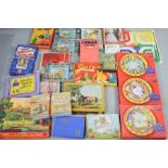 A quantity of vintage games, Jigsaw puzzles, Enid Blyton, Lumar, Snakes and Ladders board game and