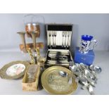 A group of collectables including a pair of brass candlesticks, biscuit barrel, canteen of