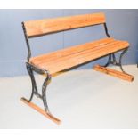 A cast iron and wooden tram bench, with two way reversible back / seat.